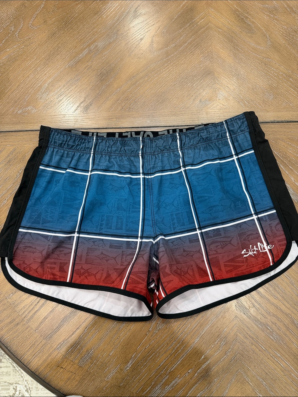 Salt Life Blue-to-Red Gradient Plaid Swim Shorts with Black Trim